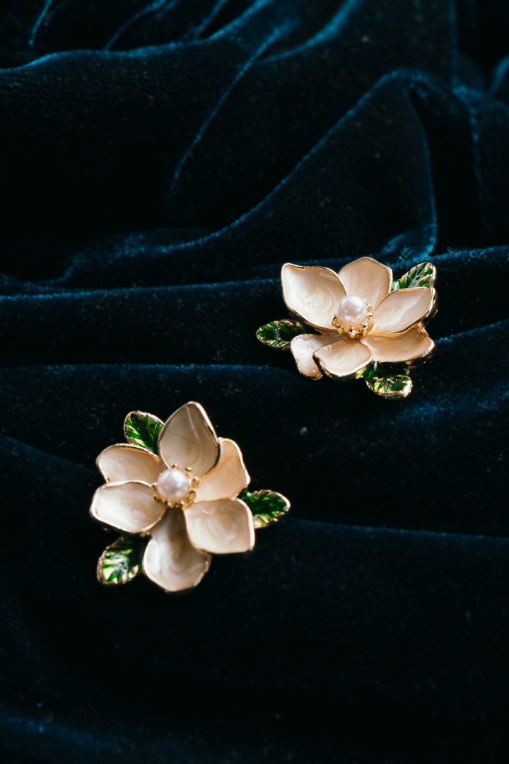 Magnolia Flower Stud Earrings with Pearl Center
– Elegant Gold Floral Jewelry with Green Leaf Accents