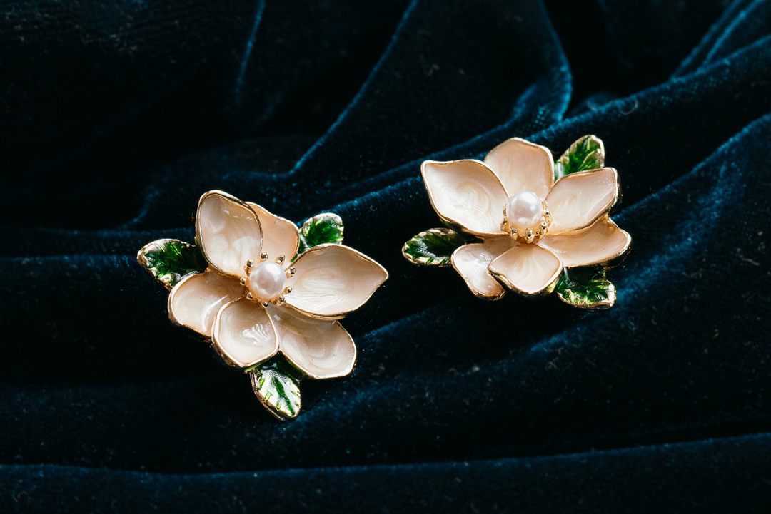 Magnolia Flower Stud Earrings with Pearl Center
– Elegant Gold Floral Jewelry with Green Leaf Accents
