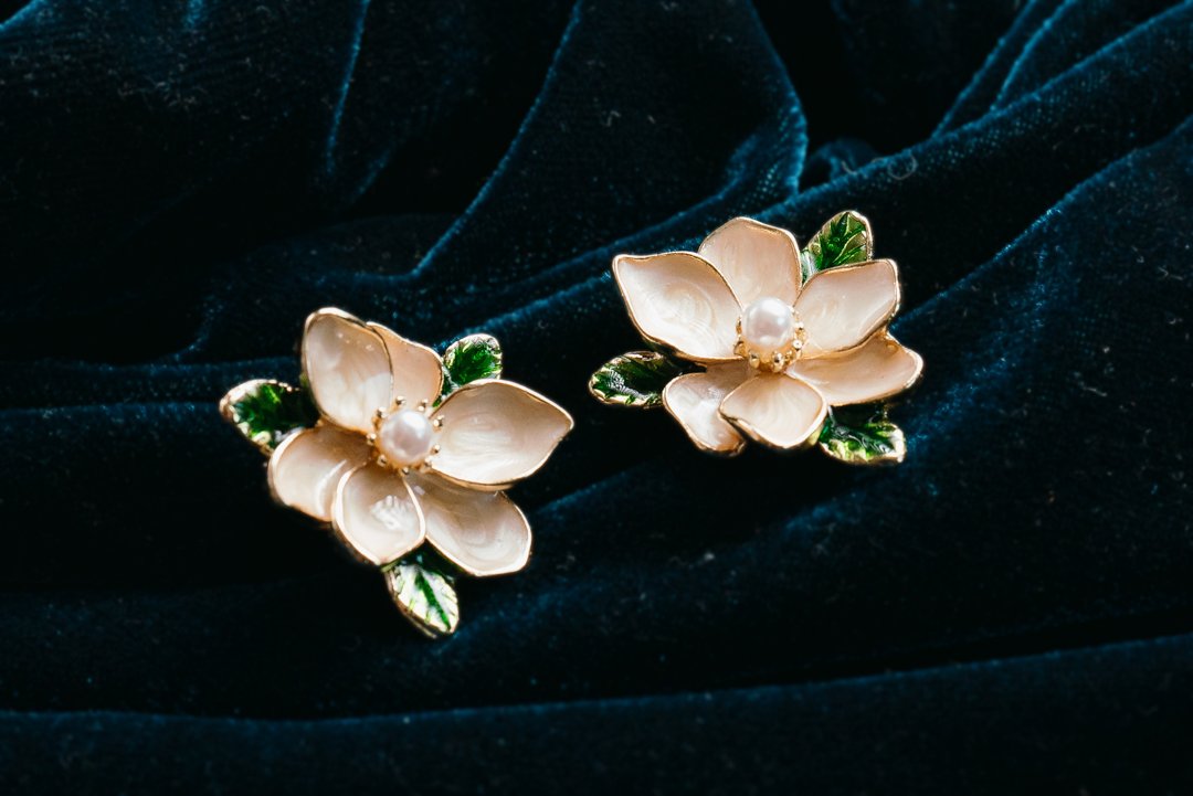 Magnolia Flower Stud Earrings with Pearl Center
– Elegant Gold Floral Jewelry with Green Leaf Accents