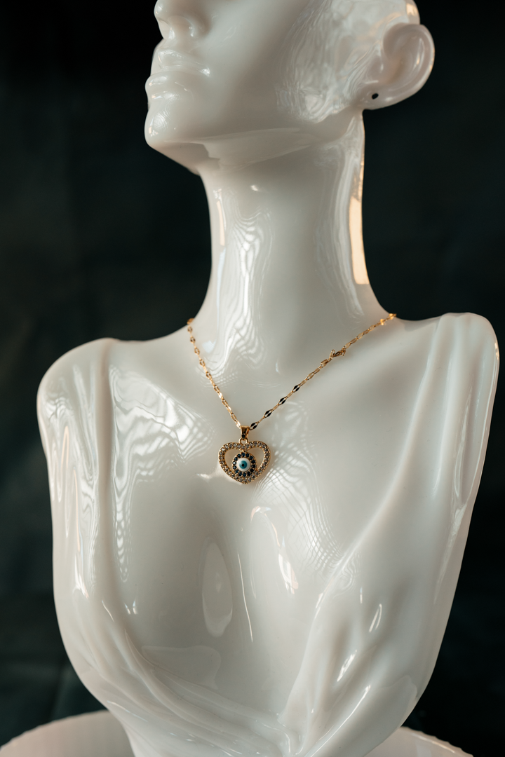 Heart-Shaped Evil Eye Necklace – Gold-Plated Protection Pendant with Blue & White Crystal Charm.