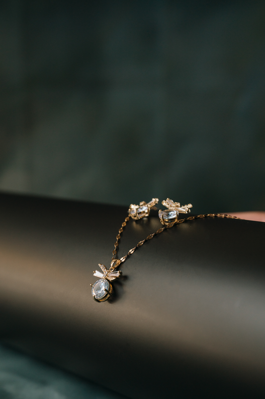 Elegant Bow Crystal Stud Earrings – Gold-Plated Sparkling CZ Statement Jewelry for Women.